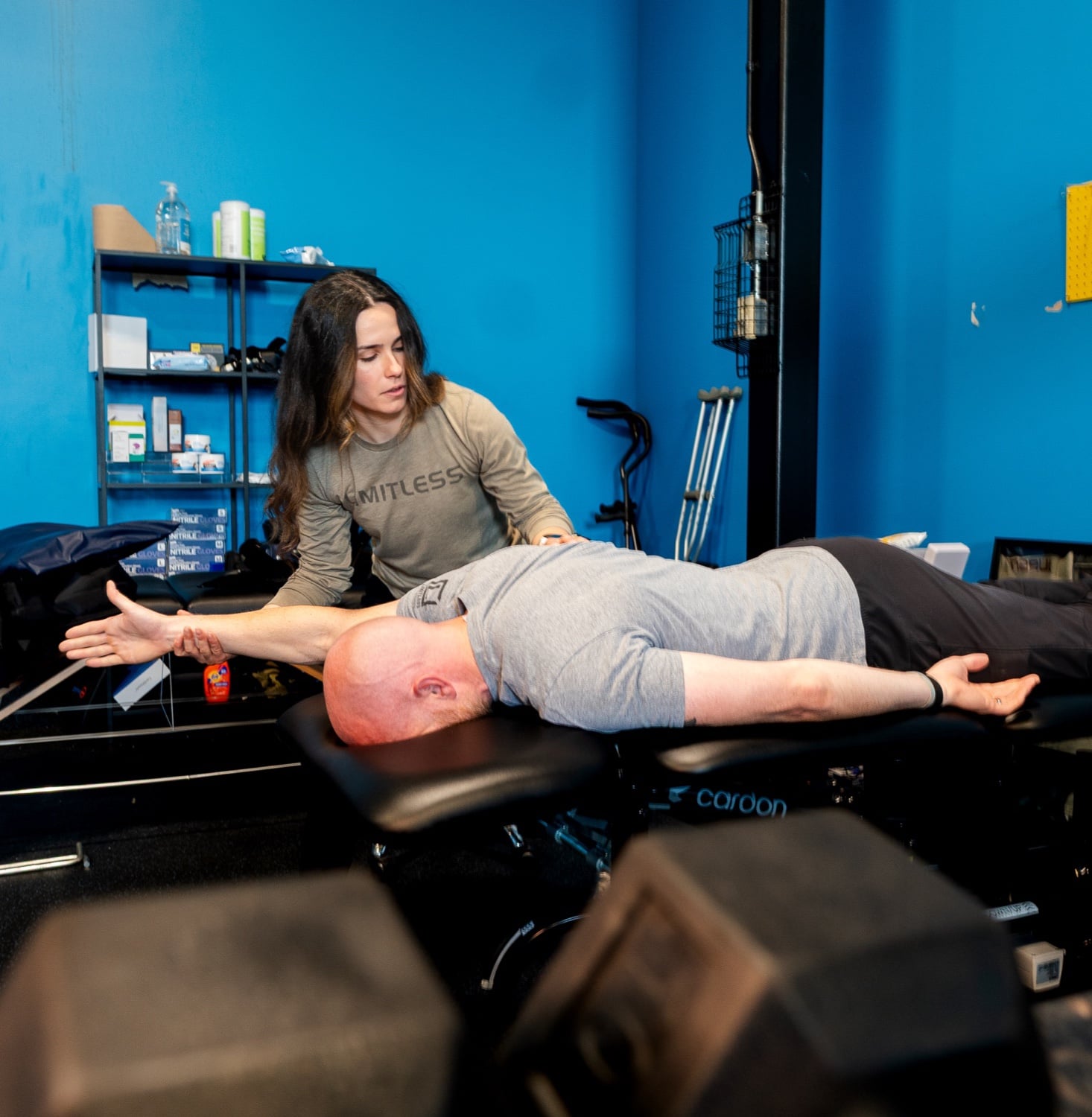 Dr. Maddy Allen guiding Dr. Seth King through a treatment session at Limitless